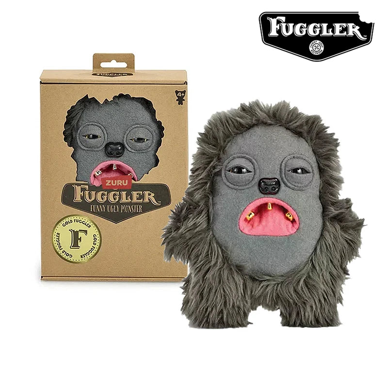 A gray monster plush toy with large eyes and pink funny teeth is shown next to its packaging.
