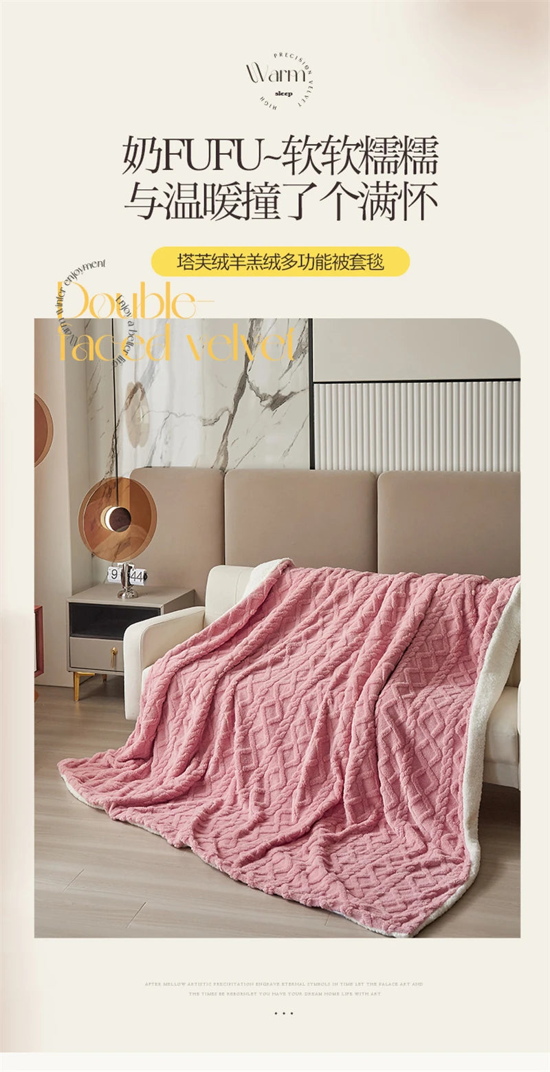 A pink velvet blanket draped over a beige sofa in a bright, modern living room setting.