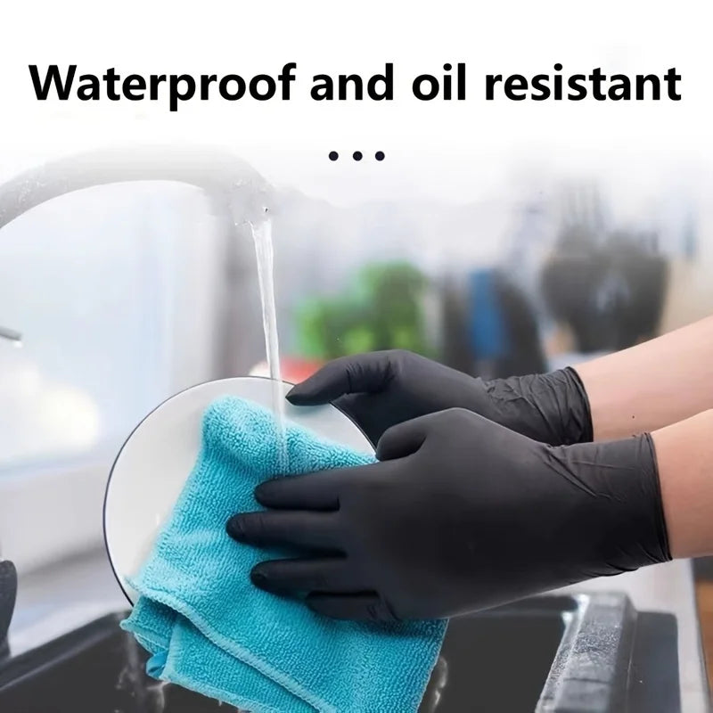 Black nitrile gloves holding a blue cleaning cloth under running water.