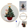 Embroidery DIY kit featuring a handcrafted Christmas tree with a squirrel and festive decorations on a canvas.