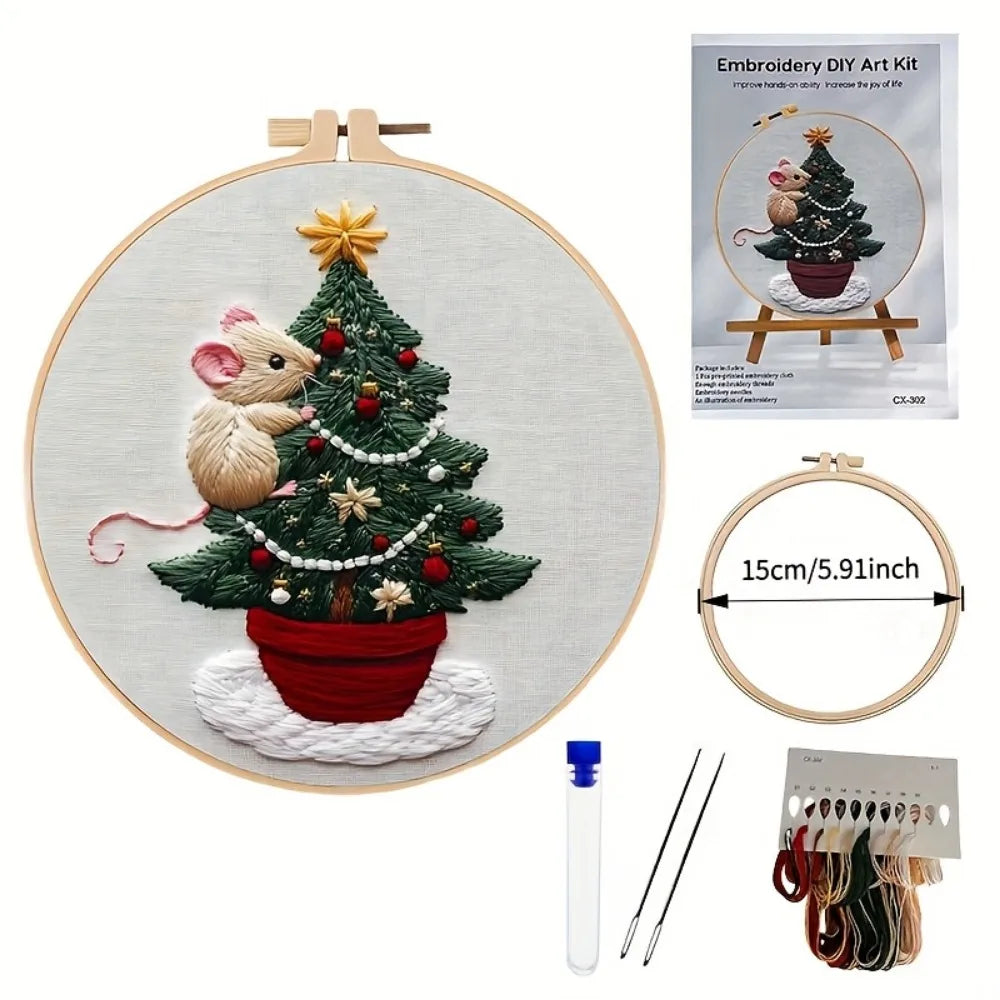 Embroidery DIY kit featuring a handcrafted Christmas tree with a squirrel and festive decorations on a canvas.