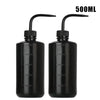 Two black tattoo squeeze bottles with precision tips and volume markings