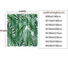 A lush green botanical leaf pattern shower curtain featuring tropical foliage designs.
