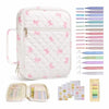 White floral quilted Bible cover with a zipper pocket and carry handle, shown alongside color pencils.
