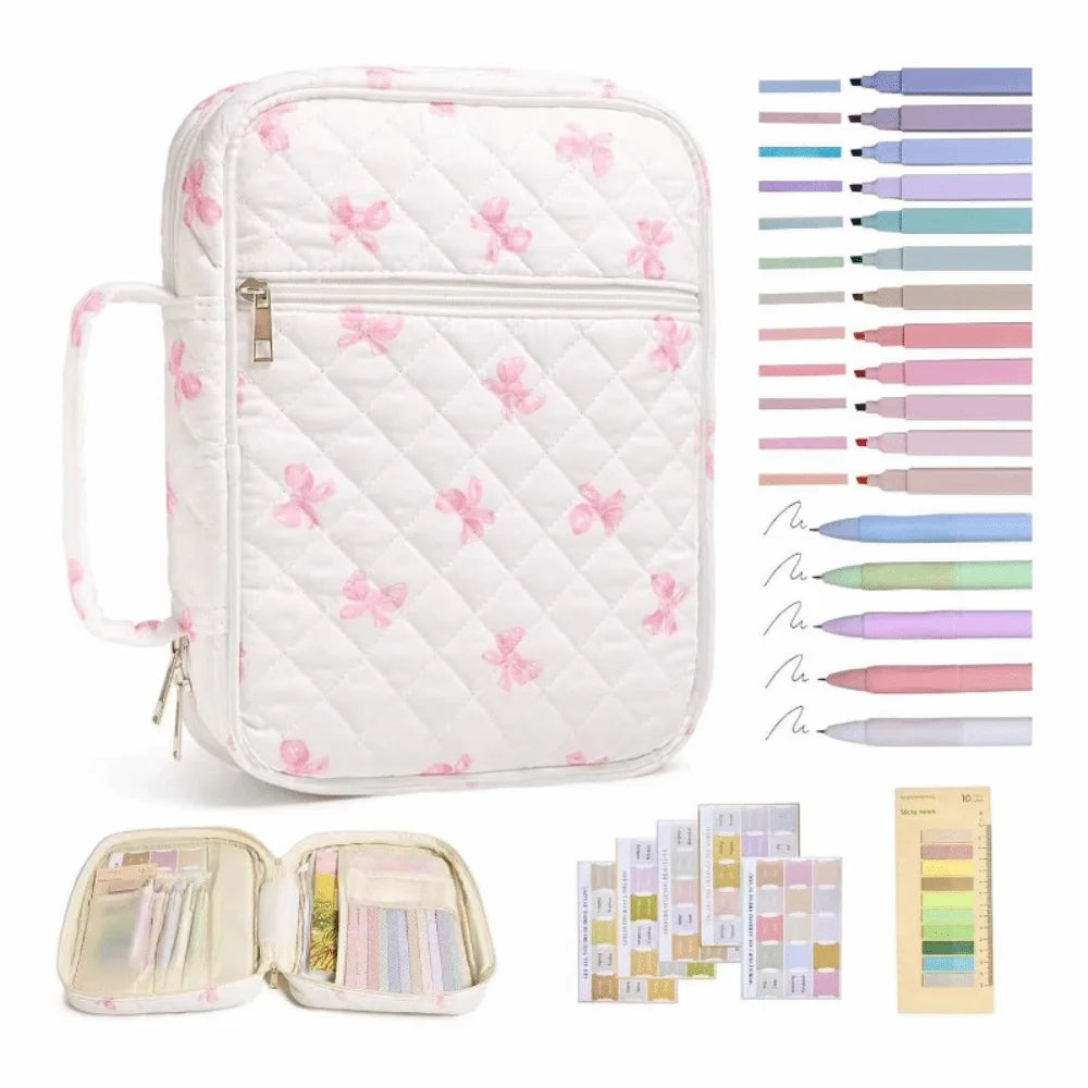 White floral quilted Bible cover with a zipper pocket and carry handle, shown alongside color pencils.
