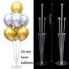 Clear plastic balloon column stands with gold and silver balloons for party decor