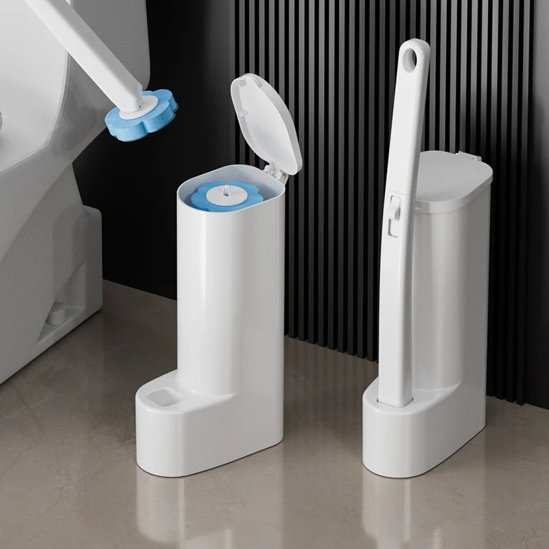 A white disposable toilet brush set with a replaceable blue head and a tall white holder is shown on a floor.