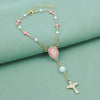 Gold and pink beaded rosary necklace with cross pendants and pearl accents