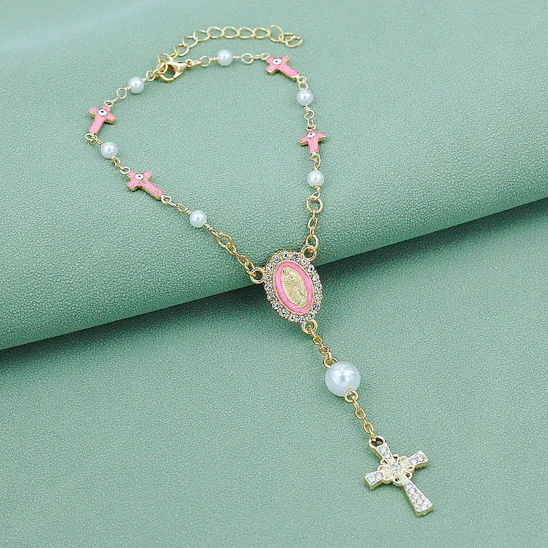 Gold and pink beaded rosary necklace with cross pendants and pearl accents