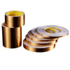 Rolls of gold-colored self-adhesive waterproof tile gap sealing tape stacked and laid out.