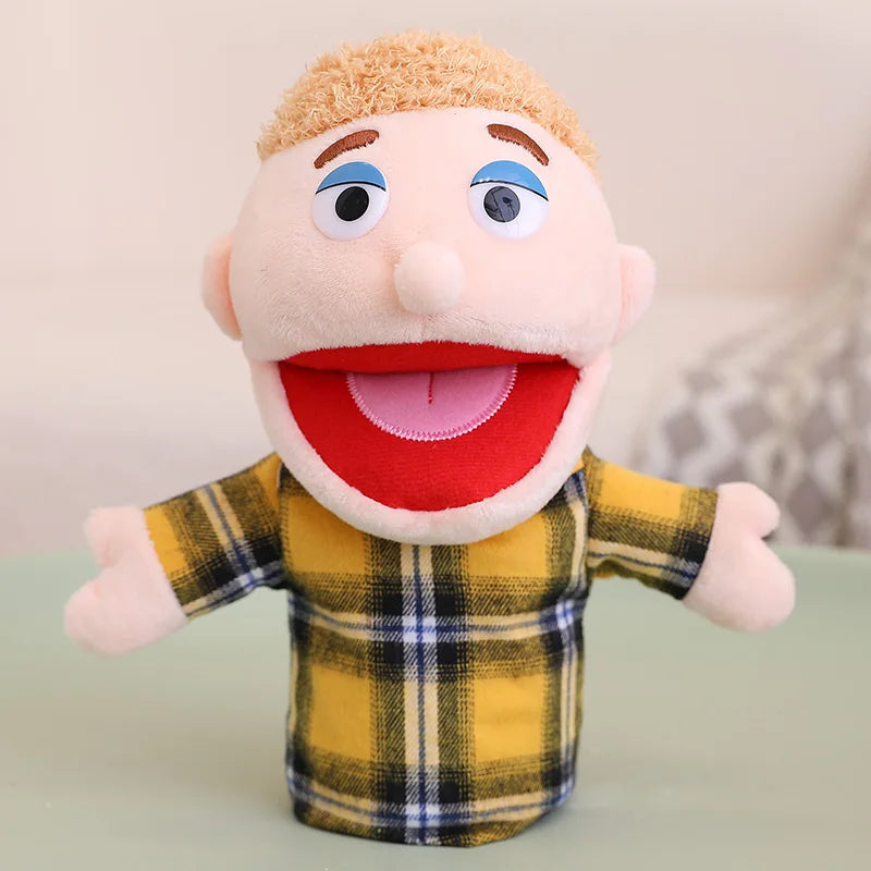 A soft plush hand puppet with light skin, blue eyes, and a red mouth, wearing a yellow plaid shirt.