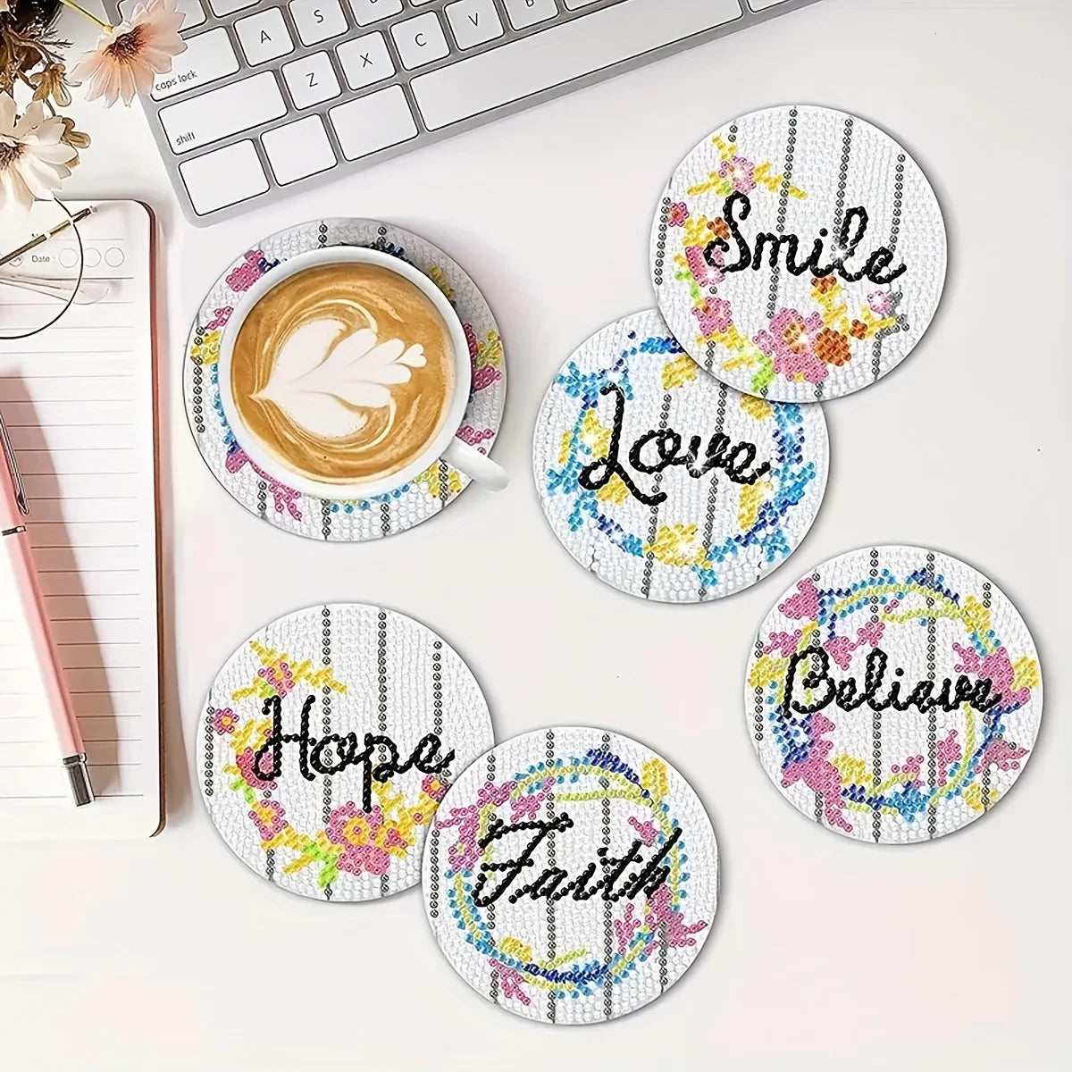 A set of diamond painting coasters featuring words like Smile, Love, Hope, Faith, and Believe on white backgrounds.