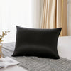 Housse de couette en soie naturelle de mûrier noire sur un tissu en lin gris.