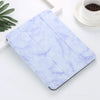 A light purple and white marble patterned iPad Pro case with a built-in pencil holder resting on a white surface.