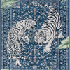 A blue area rug featuring a detailed print of two tigers, one striped and one with a mane.