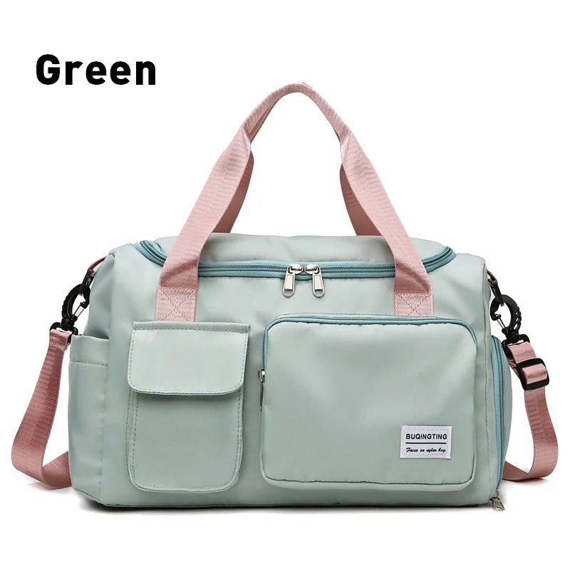A light mint green waterproof travel duffle bag with pink straps and a shoe compartment.