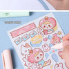 Pink and white paper featuring cute animal characters and shapes for crafting, with a pink pen-shaped safety scissor nearby.