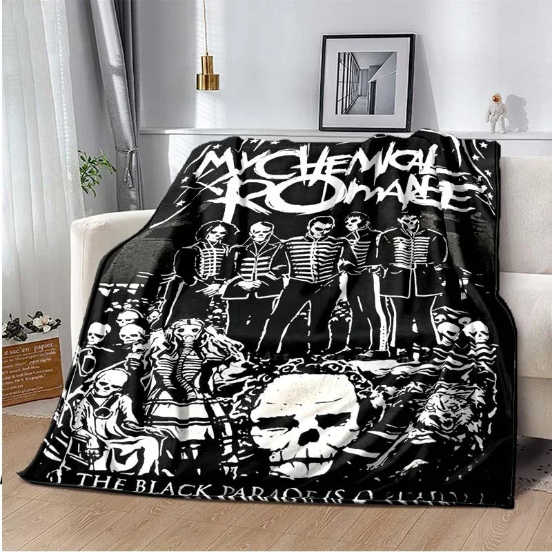 A black fleece throw blanket featuring a graphic design of the My Chemical Romance band members and skull imagery.