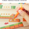 A hand is inserting a wooden peg into a maze board designed for sorting and learning.