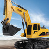 A yellow remote-controlled excavator is shown operating in a construction environment.