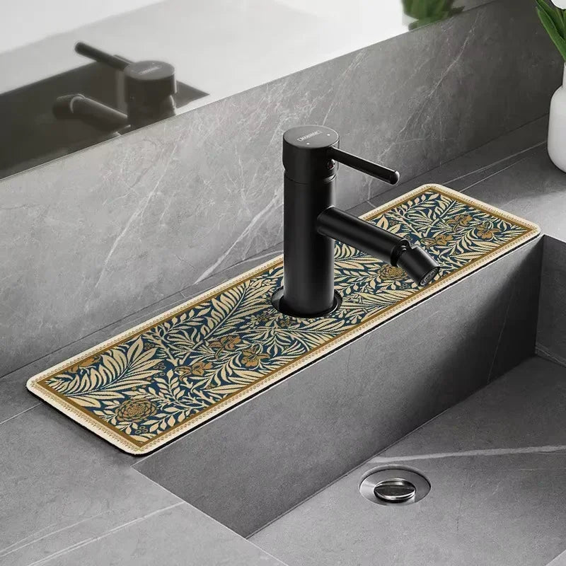 A matte black faucet mounted on a gray countertop with a floral patterned mat.