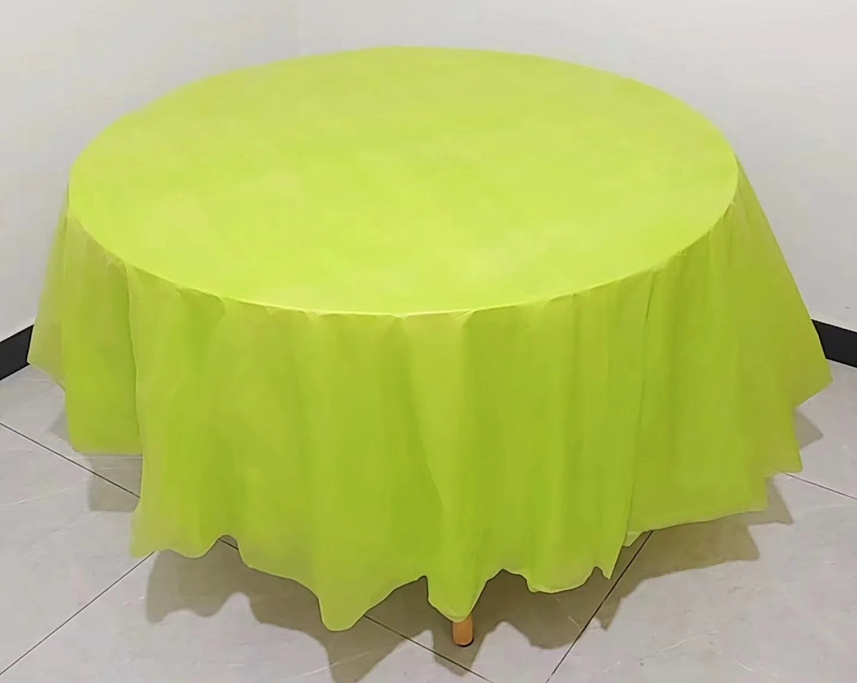 A bright lime green disposable round tablecloth is displayed on a table.