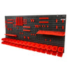 Black wall-mounted storage organizer featuring red plastic bins and parts for organization