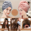 A woman models a pink knitted towel wrap for hair, showing the product texture and fit.