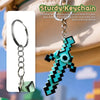 A turquoise and black gemstone toy keychain shaped like a dinosaur attached to a metal keyring.