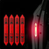 Four red reflective warning stickers are shown against a dark background, positioned on the side of a car door.