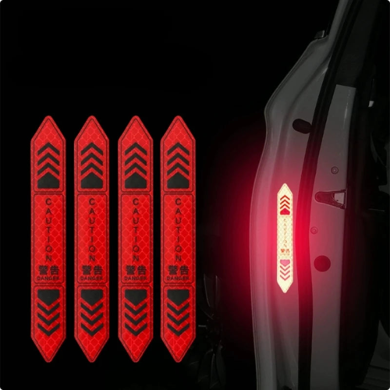 Four red reflective warning stickers are shown against a dark background, positioned on the side of a car door.