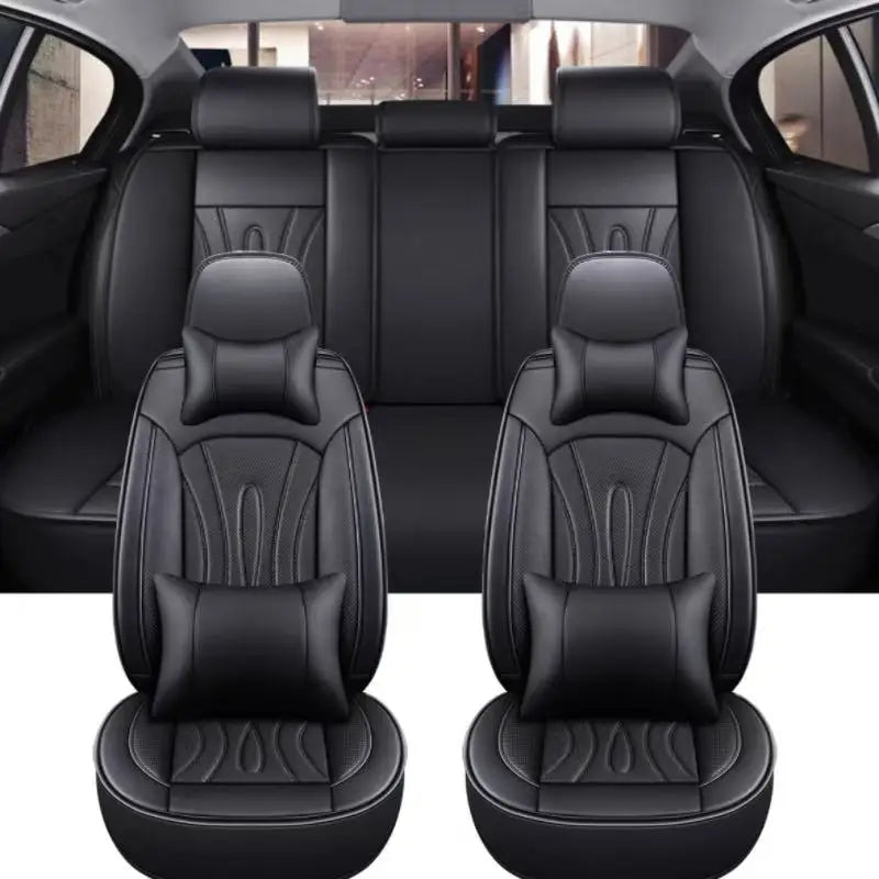 Black full coverage PU leather car seat covers shown in the interior of a vehicle.