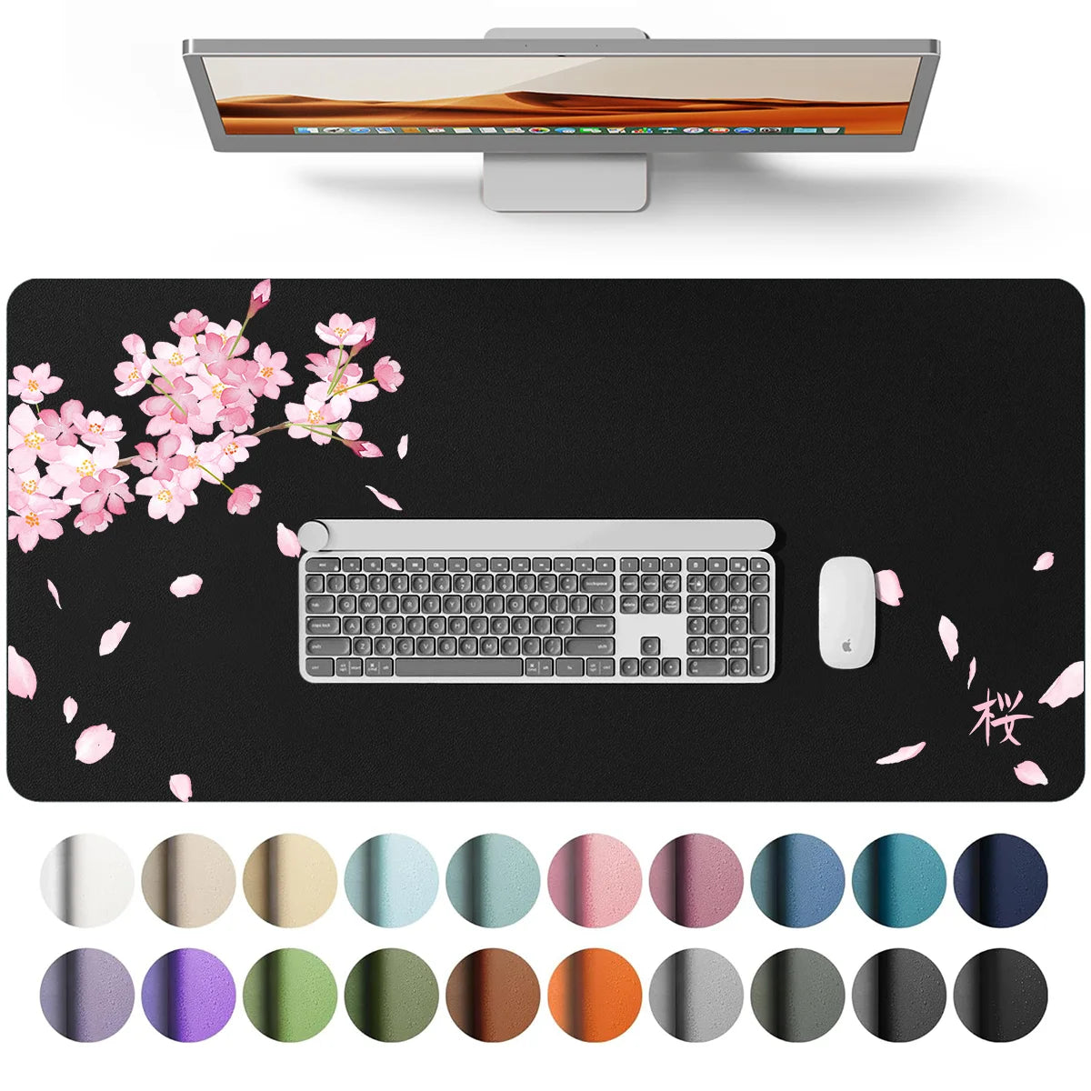 A silver laptop is shown above a black desk pad featuring a keyboard, mouse, and various colored circular accents.