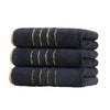 A stack of three dark gray coral fleece towels with gold stripes.