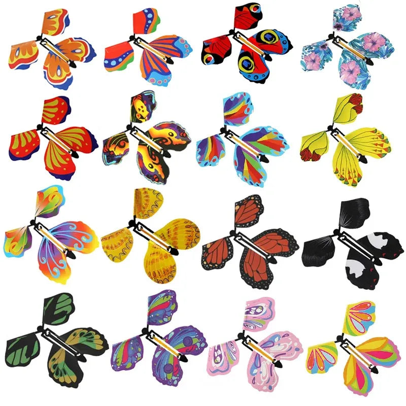 A collection of ten magic flying butterfly wind-up toys in various colors and designs.