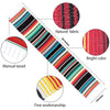 A vibrant Mexican serape table runner featuring multicolored stripes, tassels, and fine workmanship.