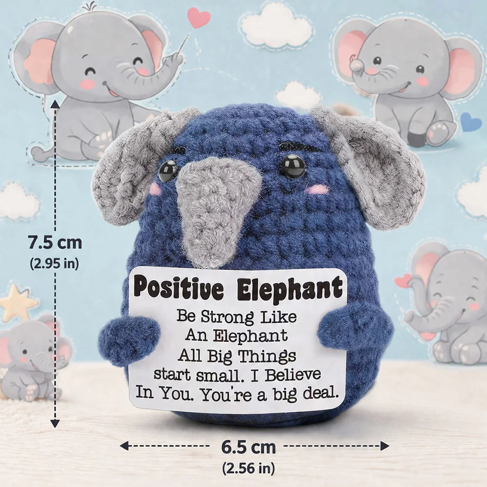 A blue elephant crochet plush toy with large ears and a tag that reads Positive Elephant
