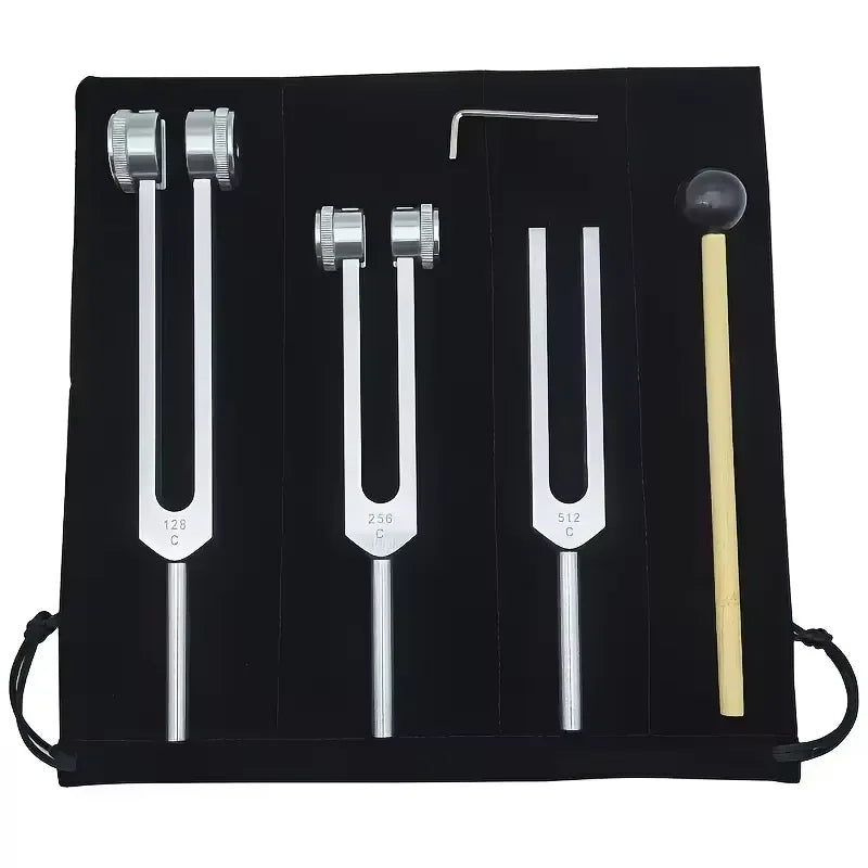 A black case containing a set of tuning forks with various sizes and metal handles.