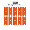Ten orange plastic razor blades arranged in a grid for replacement.