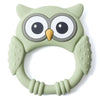 A light green silicone owl-shaped teether and rattle for babies with large eyes and textured body.