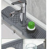 A non-slip silicone kitchen sink mat with a drain tray is shown in various applications for accelerating the drain effect.