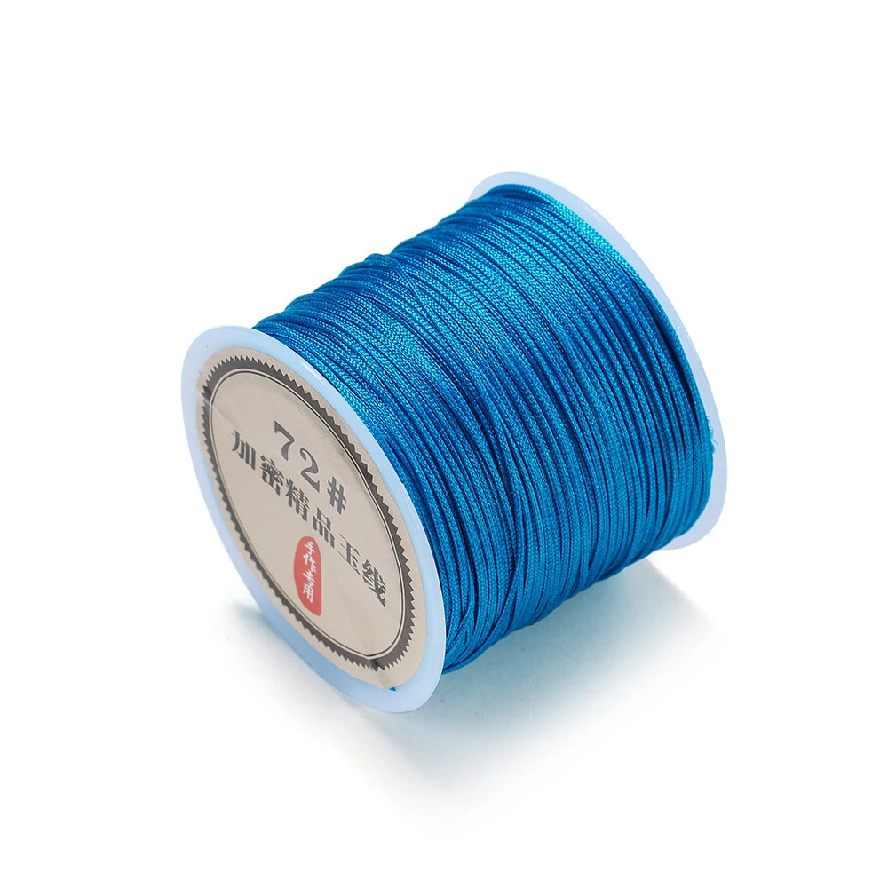 Spool of bright blue 0.8mm nylon macramé cord for jewelry making