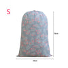 Light blue drawstring laundry bag with a floral pattern