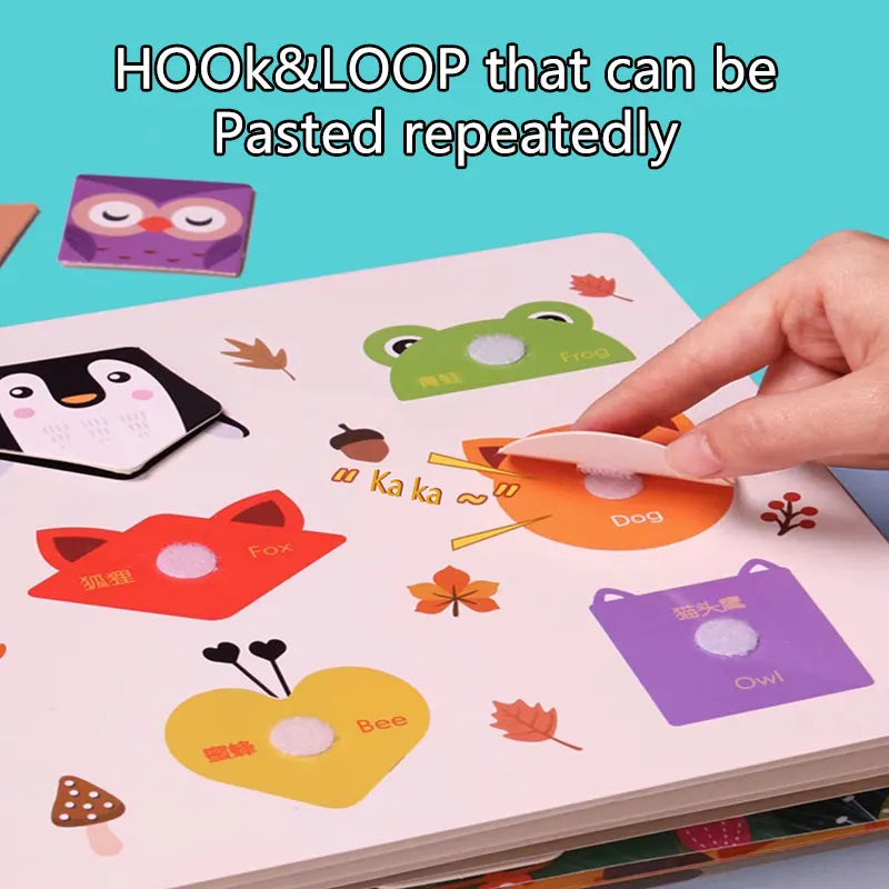 A hand is pasting a colorful hook and loop item onto a Montessori busy book page.