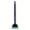 A black tool with a long handle and a green plastic blade used for car window film installation or snow shoveling.