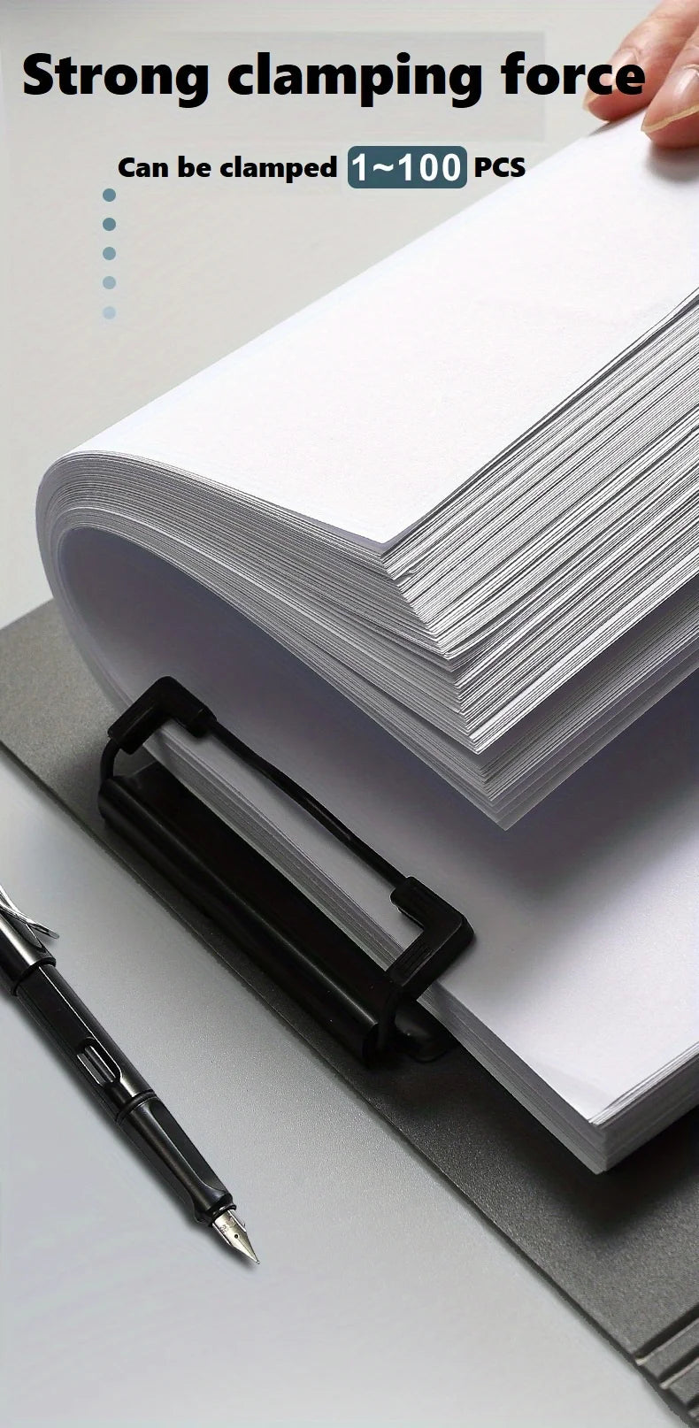 A stack of white paper documents is held by a black clip folder, demonstrating strong clamping force.