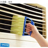 A hand is using a blue dusting brush to clean the slats of a window blind or vent.