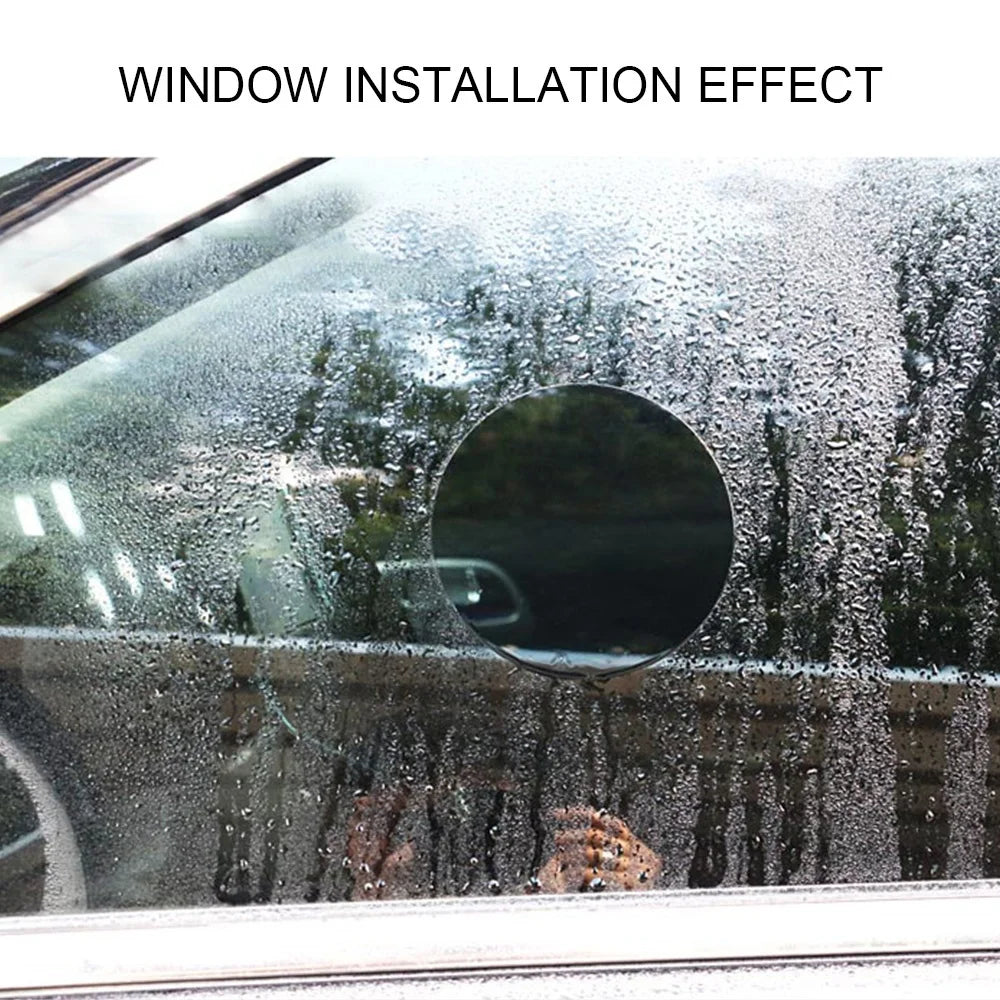 A car window covered in water droplets showing a circular mirror film installation effect.