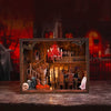 A wooden book nook kit featuring a spooky Halloween miniature shelf insert with detailed figures and LED lights.