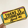 A yellow embroidered patch with black text that reads There Is Nothing Basic About Me